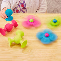 Girl Playing with Whirly Squigz Toy
