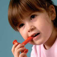 Girl Using Red Chewable Tube
